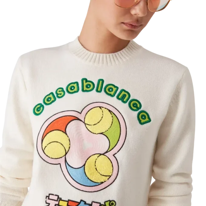 Jersey de cuello redondo de punto merino con estampado de pelotas de tenis Jersey de cuello redondo de punto merino con estampado de pelotas de tenis